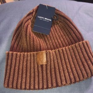 NWT Lucky Brand ribbed beanie, rum raisin color. One size. Leather lucky logo.